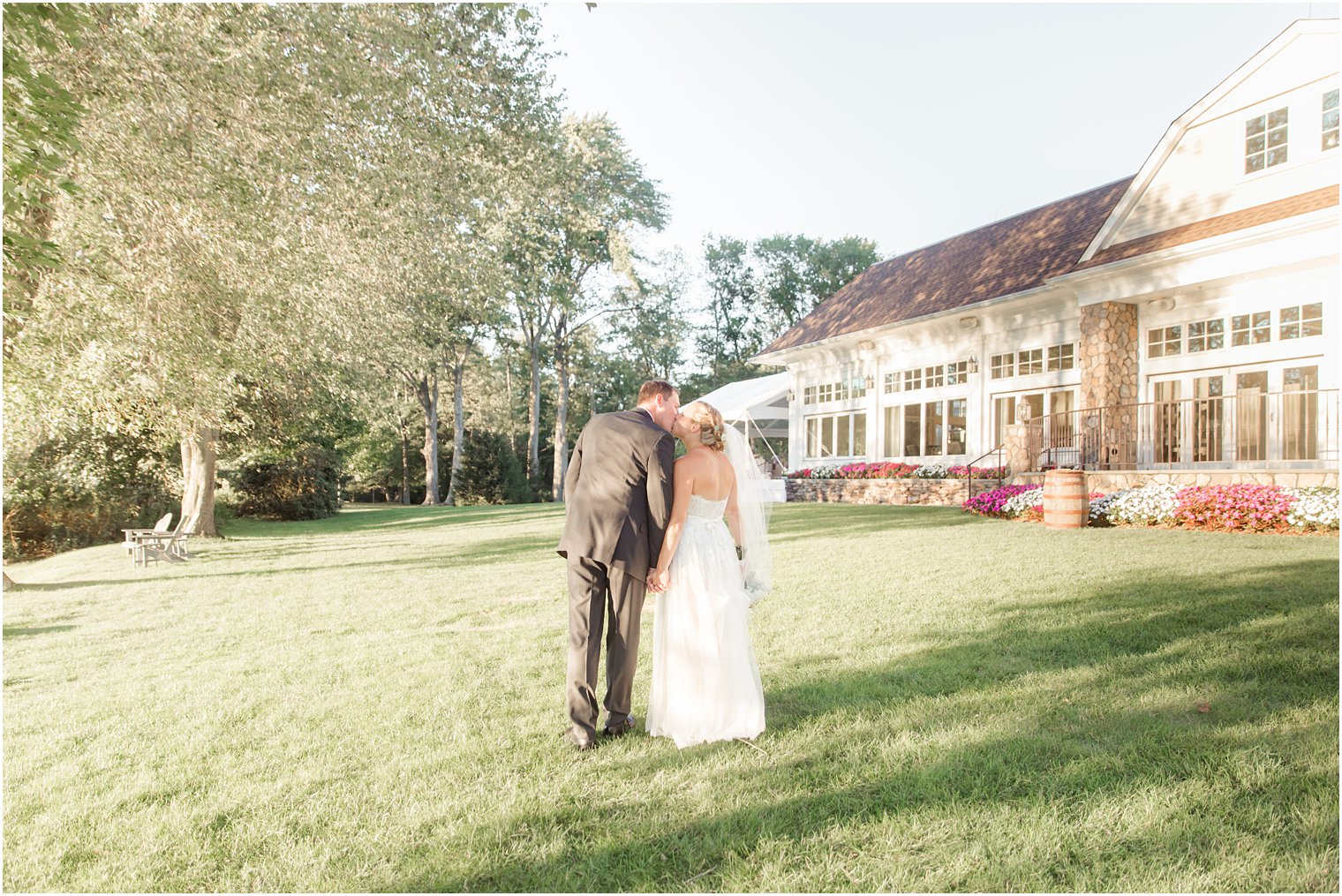 couple kisses by Indian Trail Club after NJ wedding