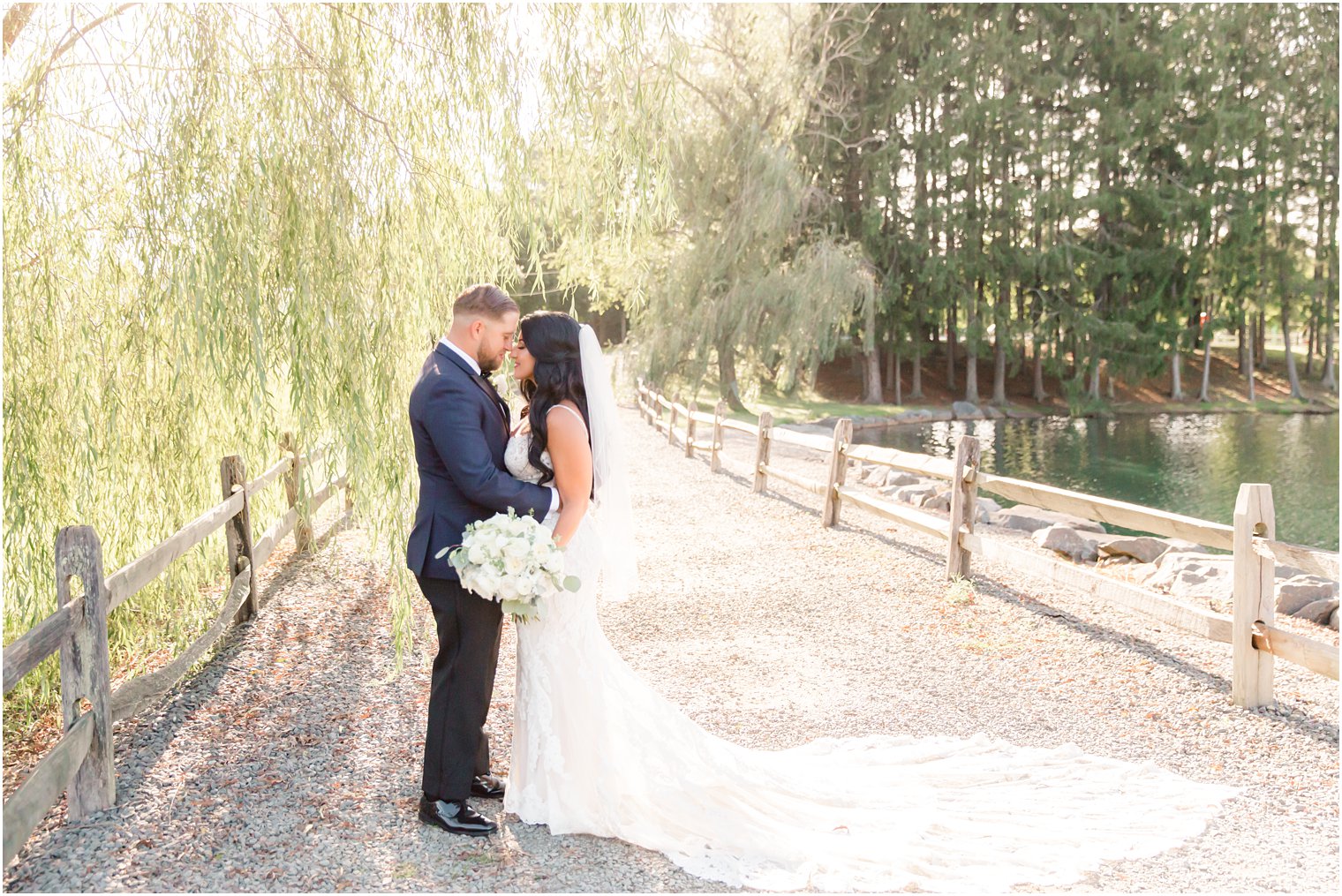 portraits of bride and groom by weeping willow in Millstone NJ