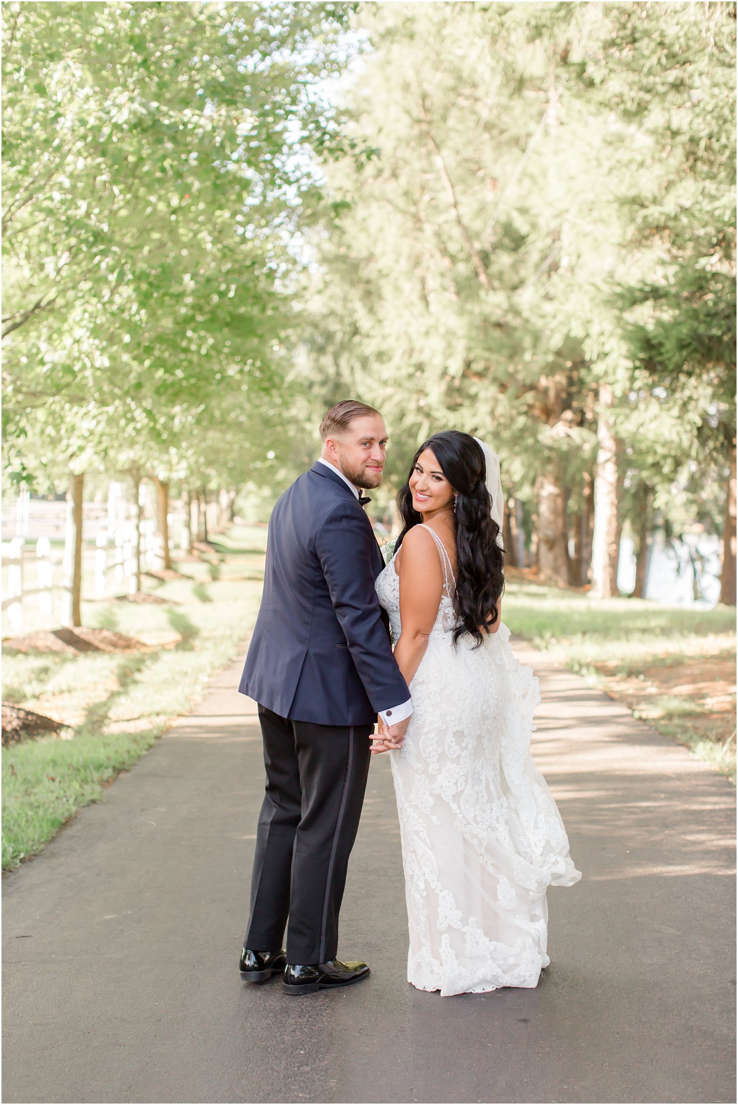 Windows on the Water at Frogbridge wedding portraits with bride holding train