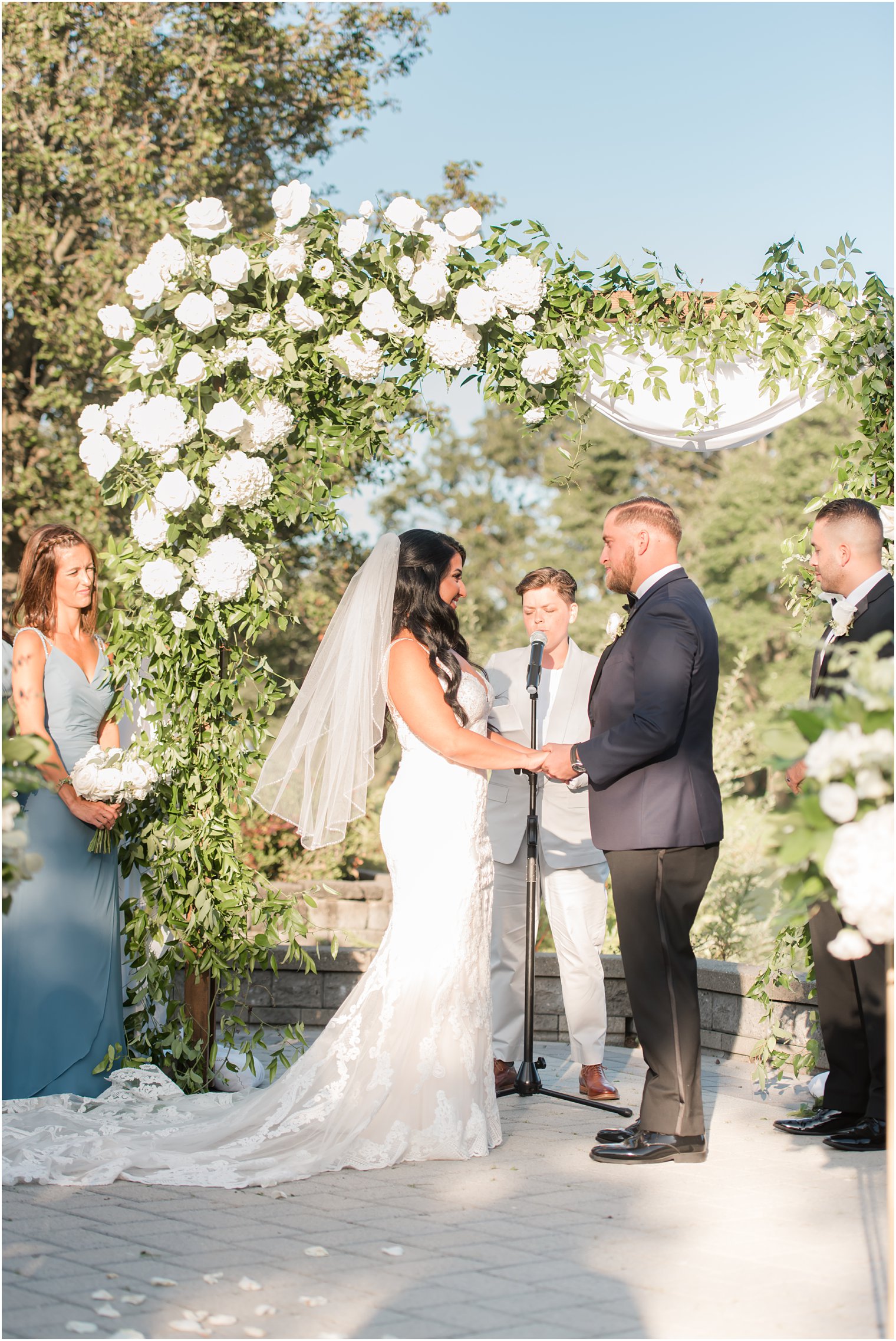 bride and groom exchange vows during Windows on the Water at Frogbridge wedding ceremony