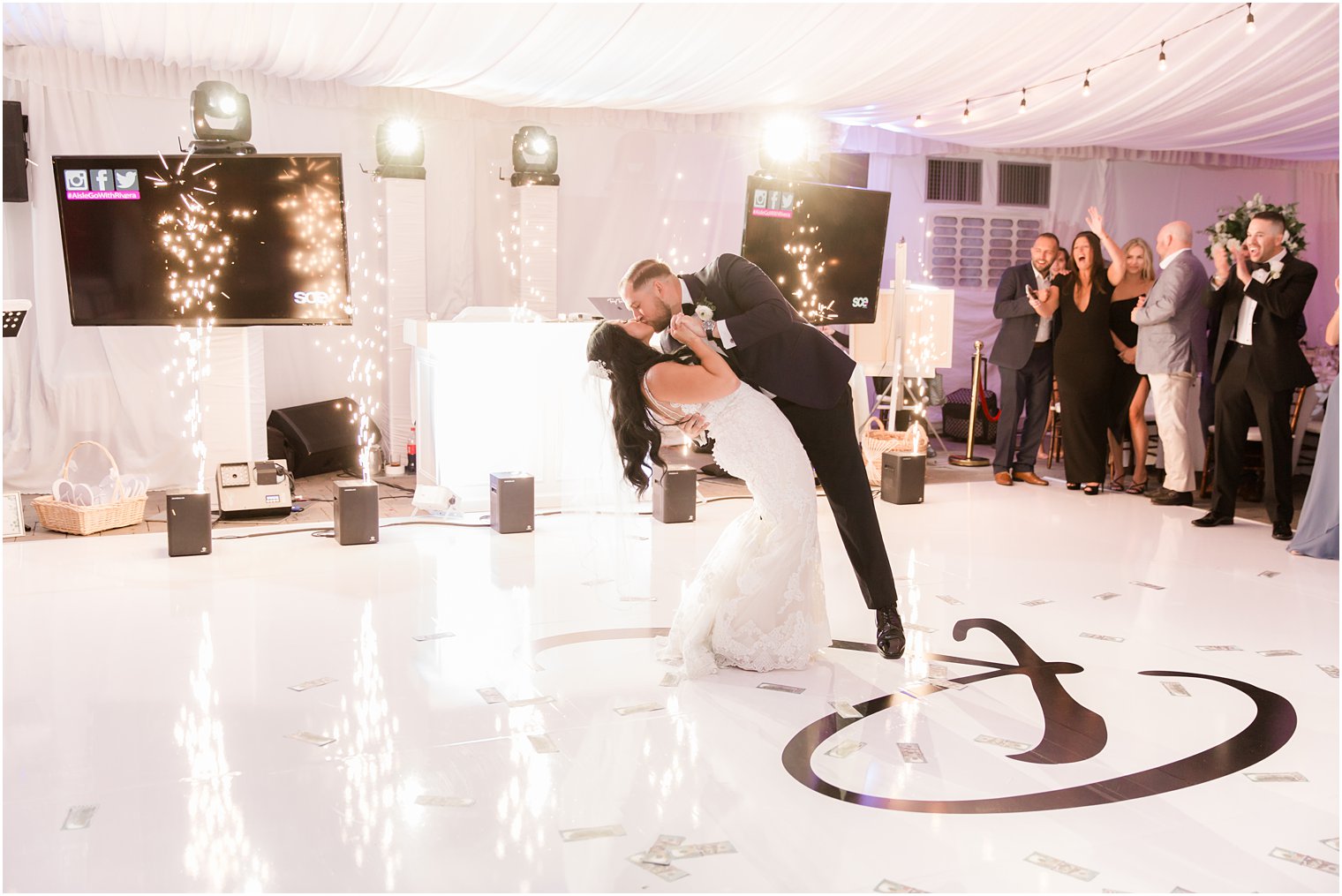 groom dips bride during Windows on the Water at Frogbridge wedding reception dances