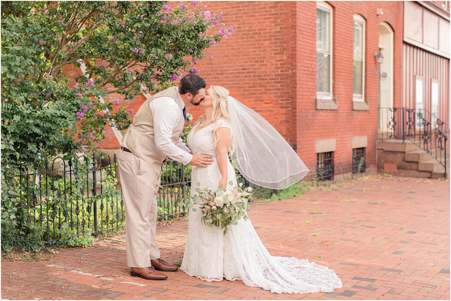 groom kisses bride during Burlington NJ wedding day