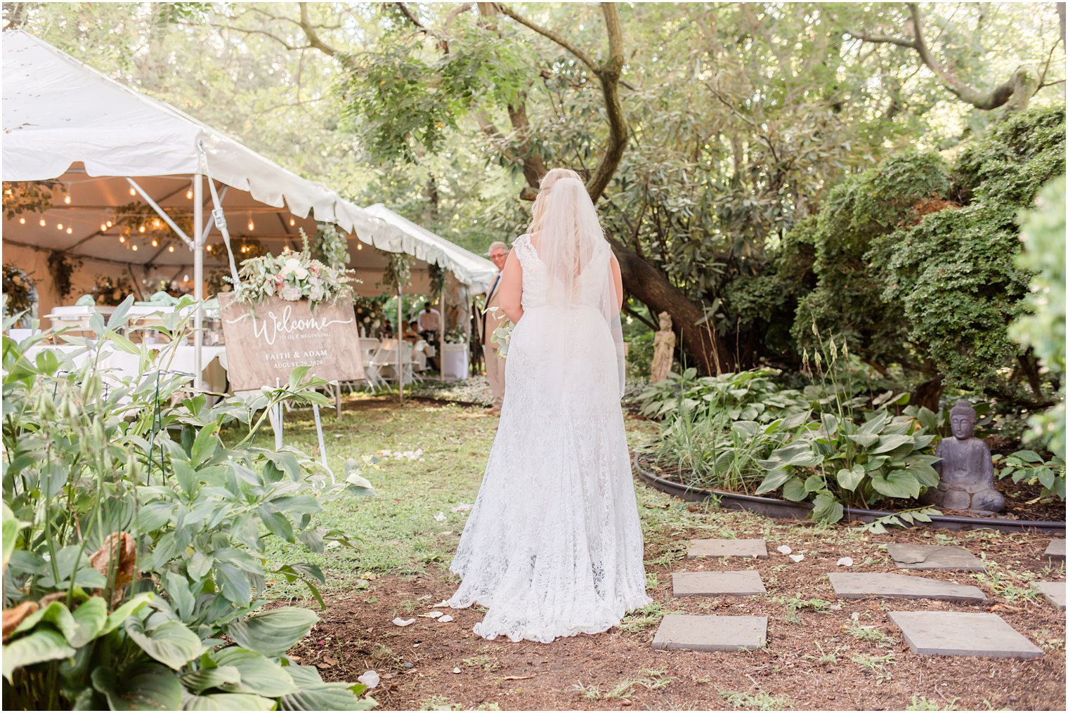 bride walks into ceremony outside the Lily Inn