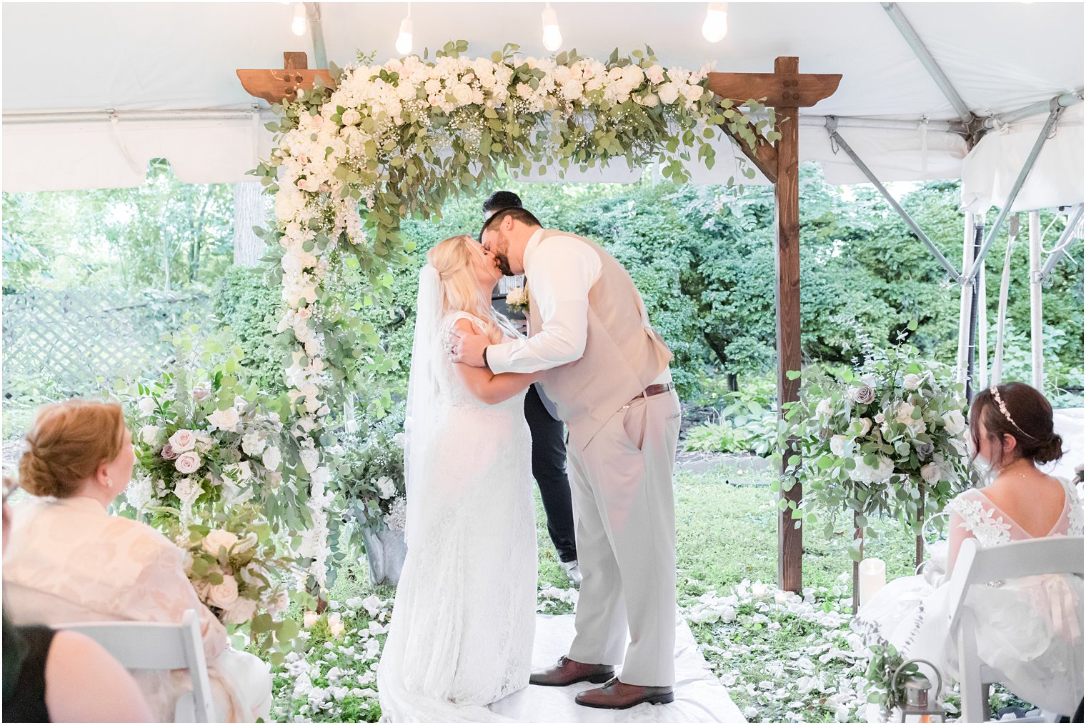 newlyweds kiss at the altar during Micro Wedding at The Lily Inn