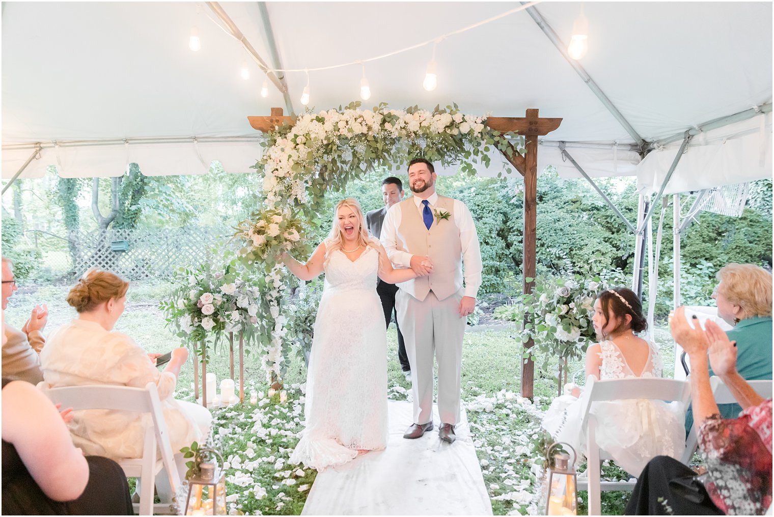 bride and groom cheer after wedding ceremony at The Lily Inn