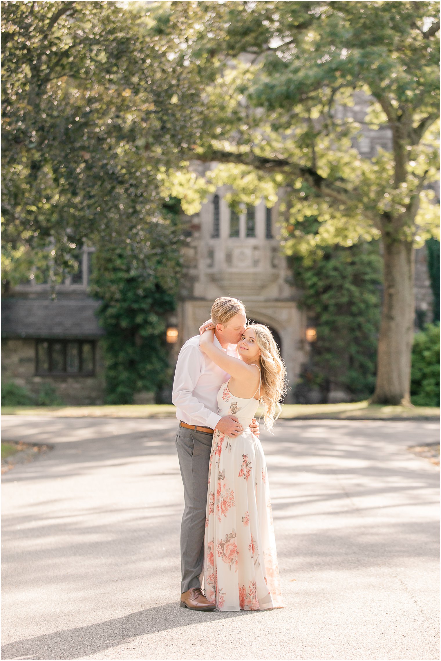 groom kisses fiancee's cheek during Ringwood NJ engagement photos