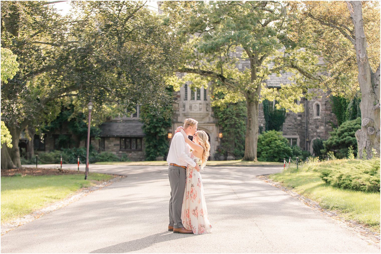 bride hugs groom around neck during Skylands Manor Engagement Session