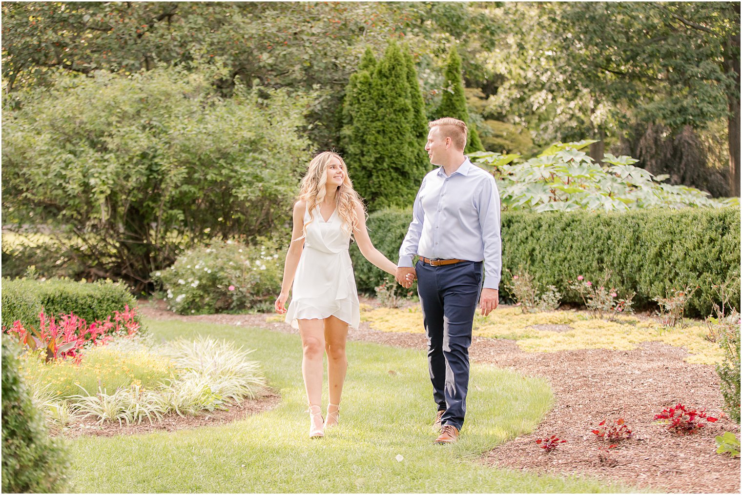 couple walks through Skylands Manor during Engagement Session