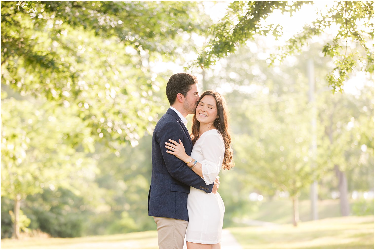 groom kisses fiancee during NJ engagement session 