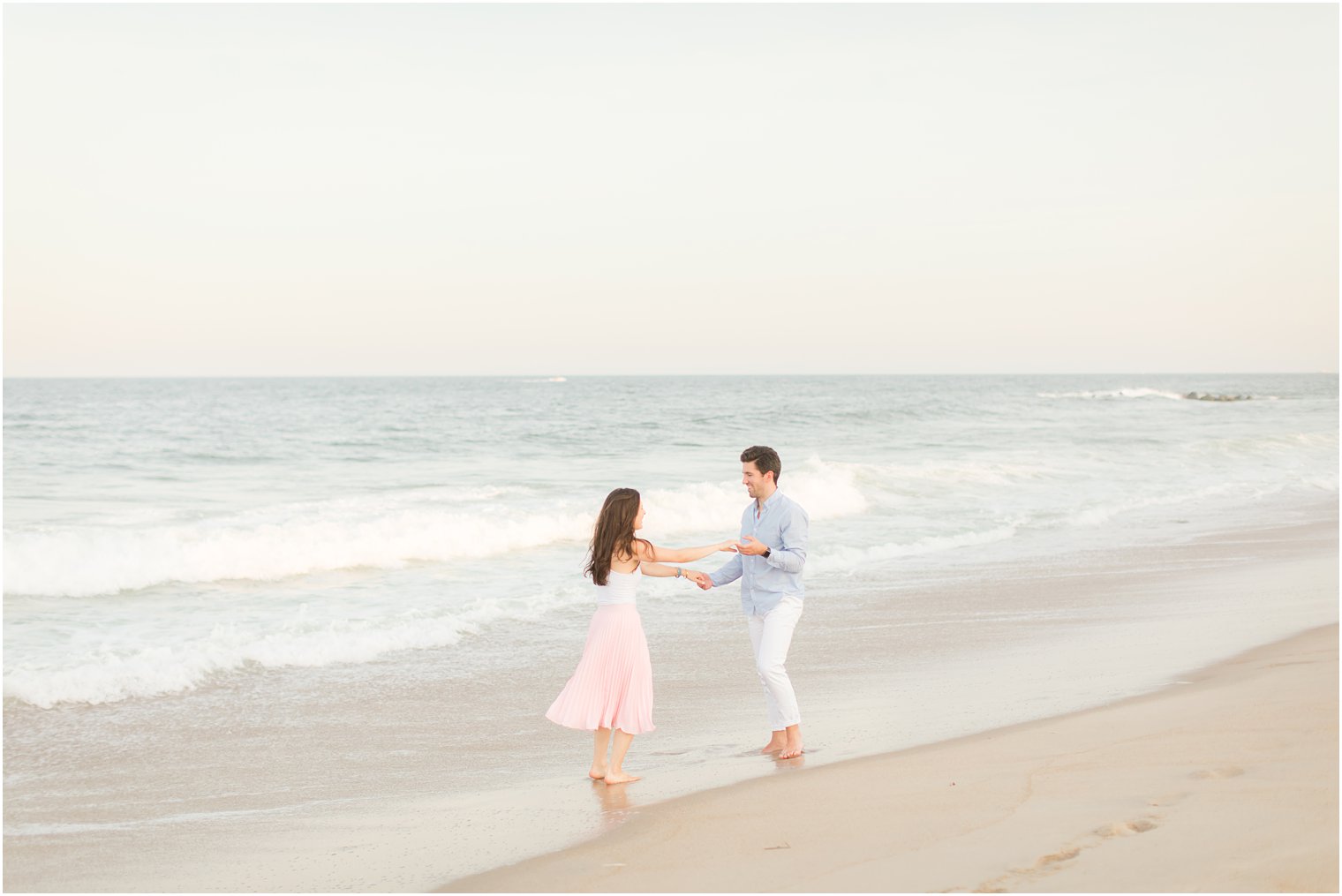 New Jersey couple dances in the ocean during engagement photos