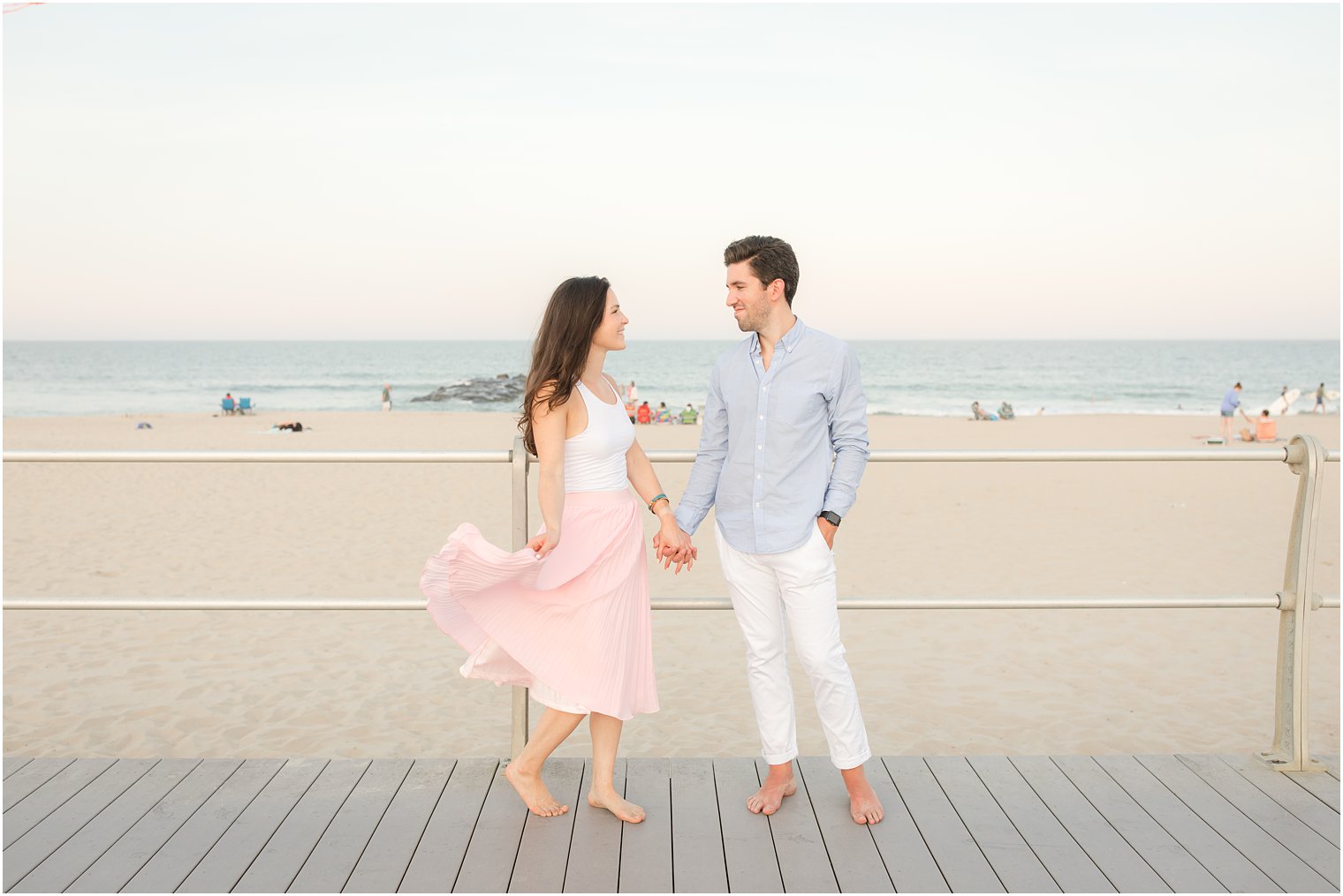 summer boardwalk engagement portraits in Spring Lake NJ