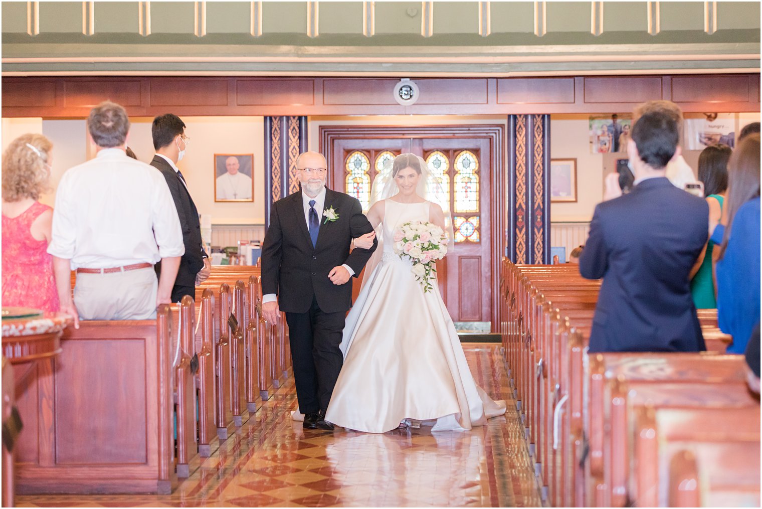 Bride walking down the aisle with her father at Church of the Assumption in Morristown, NJ