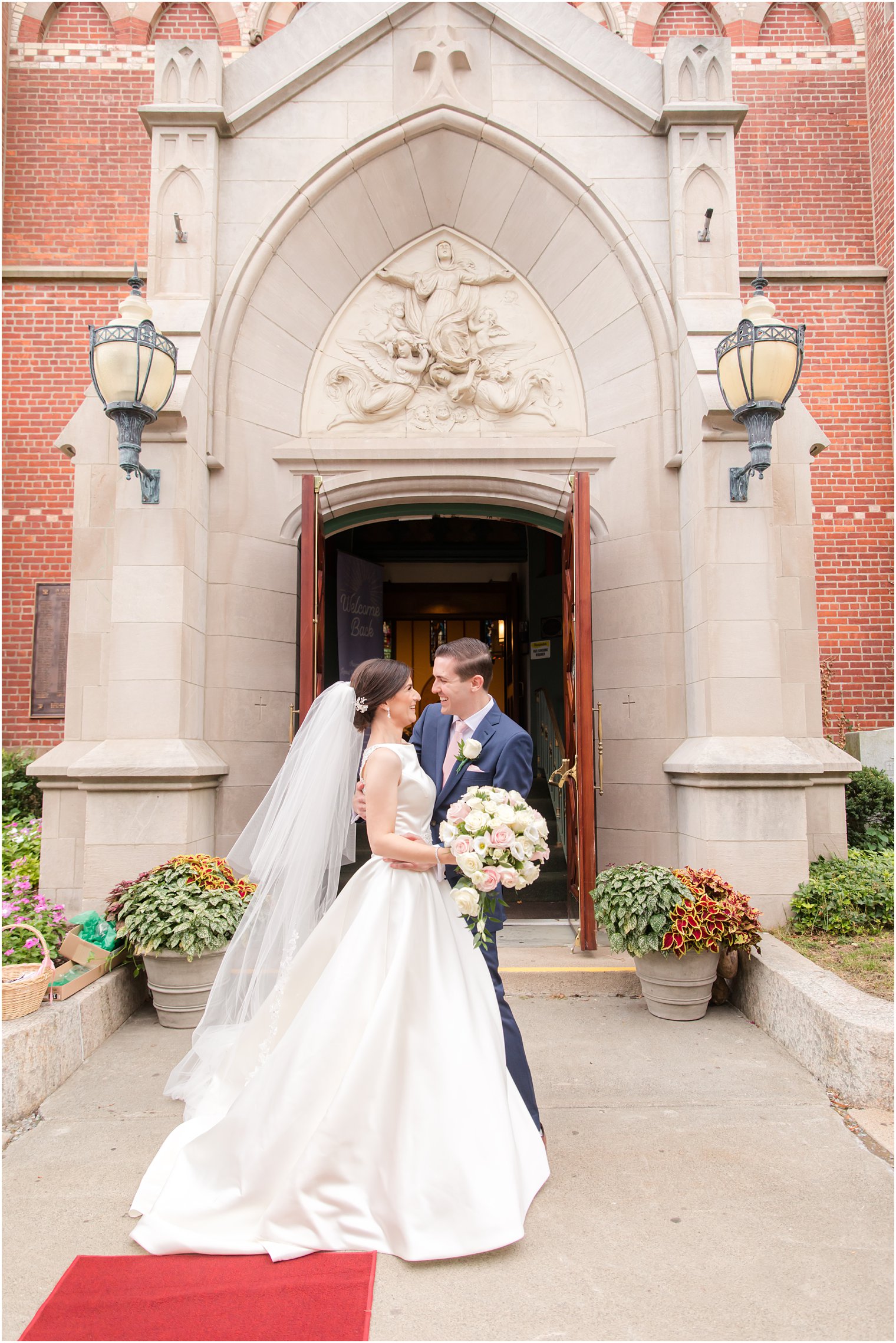 Bride and groom exiting church at Church of the Assumption in Morristown, NJ