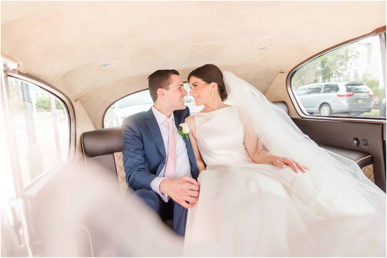 Bride and groom in Rolls Royce