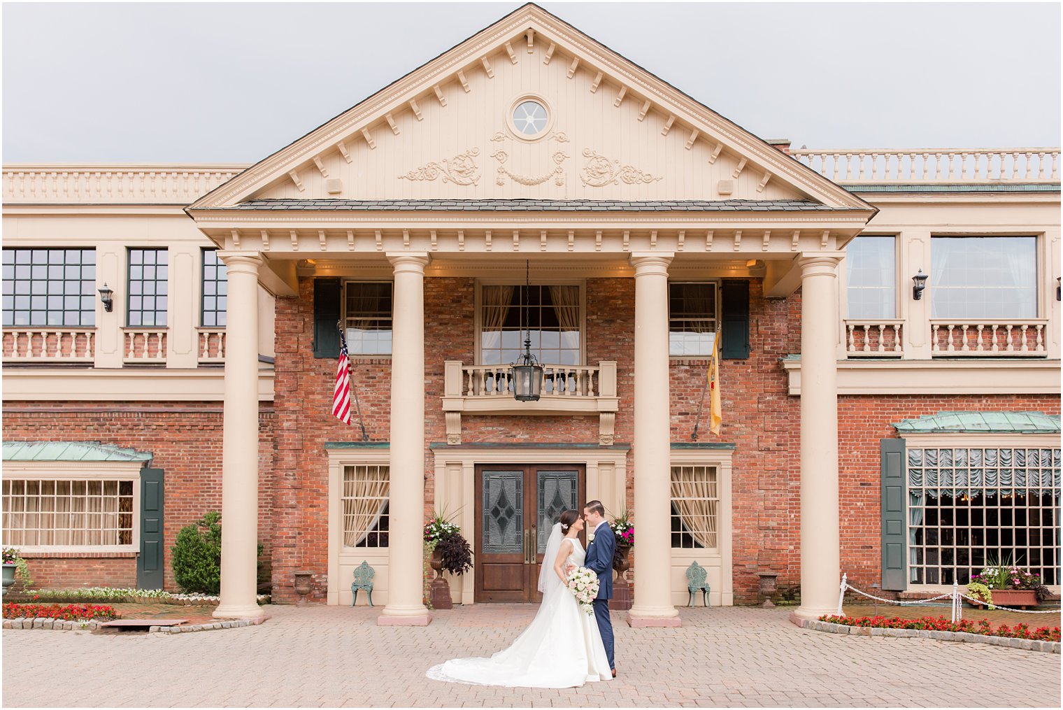 Bride and groom in front of The Manor in West Orange NJ