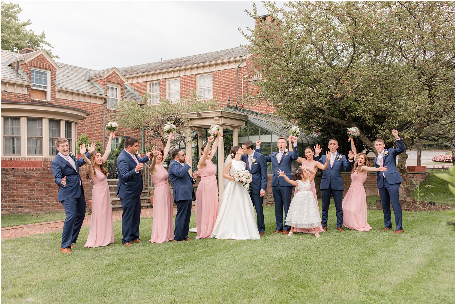 Bridal party cheering for bride and groom