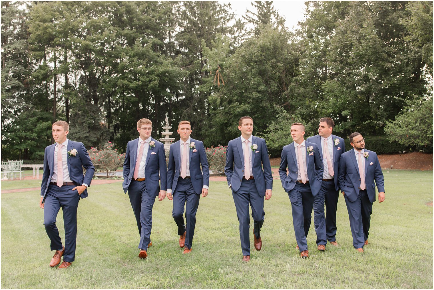 Candid photo of groomsmen walking