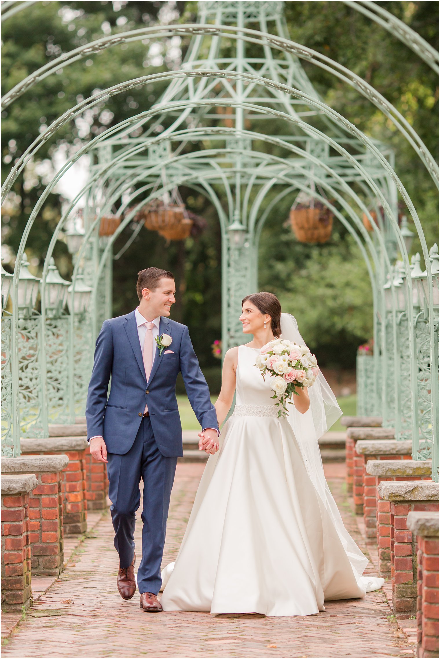 Bride and groom walking at The Manor in West Orange NJ