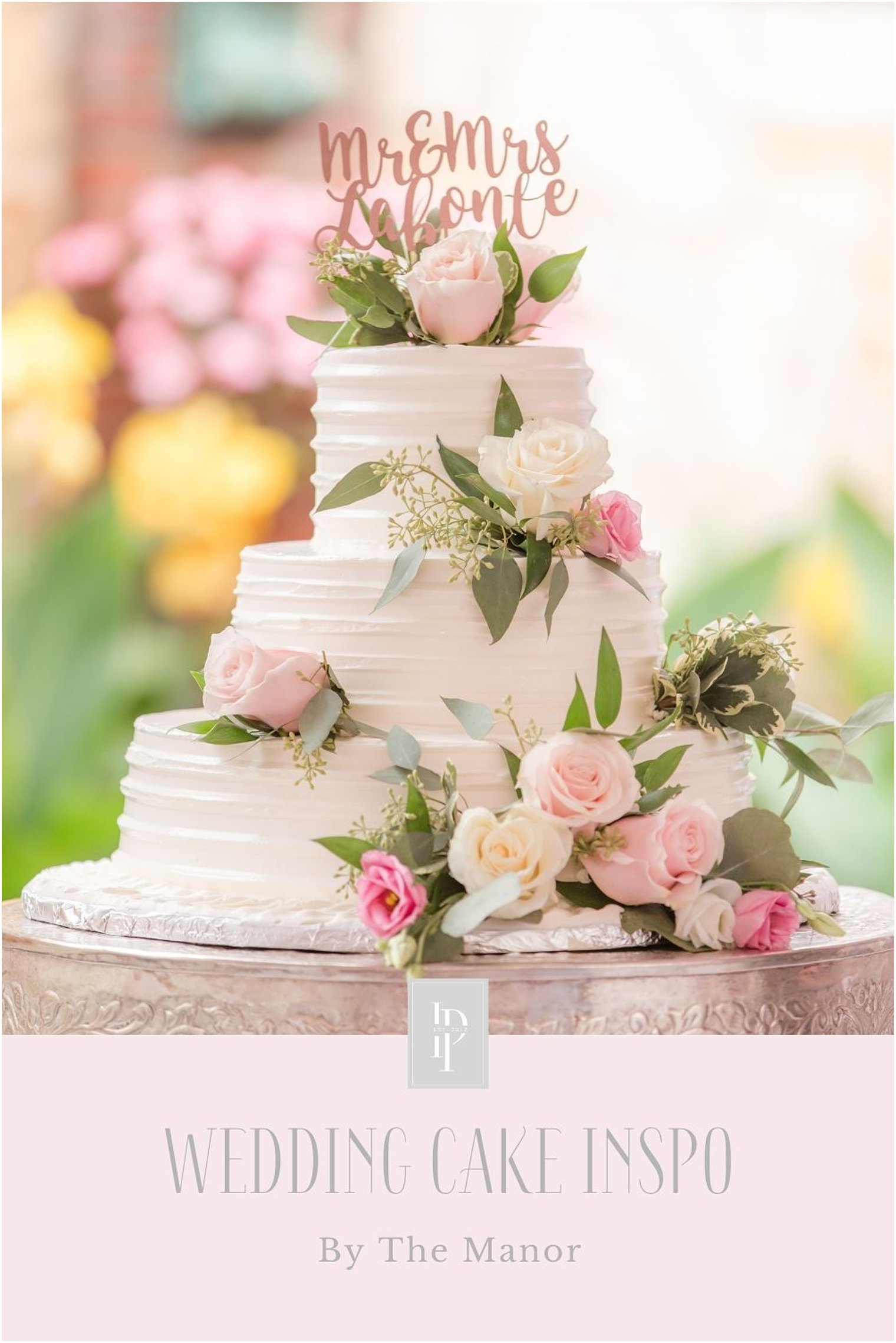 Wedding cake with florals by The Manor