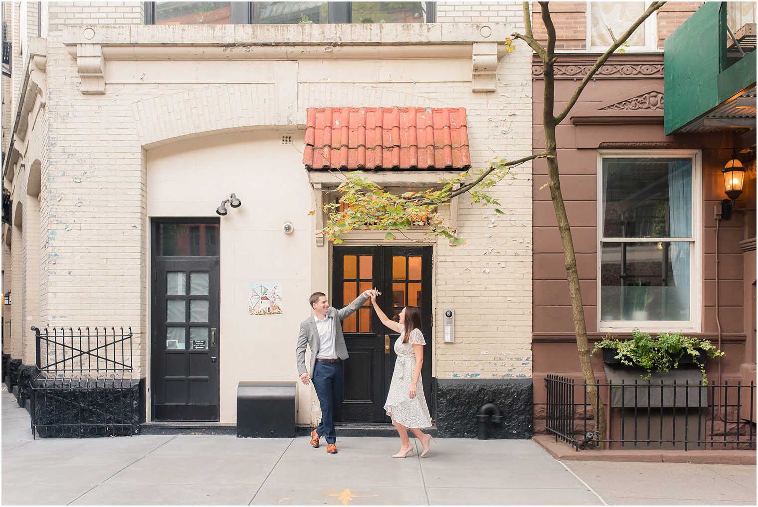 couple dances in West Village NY during engagement photos