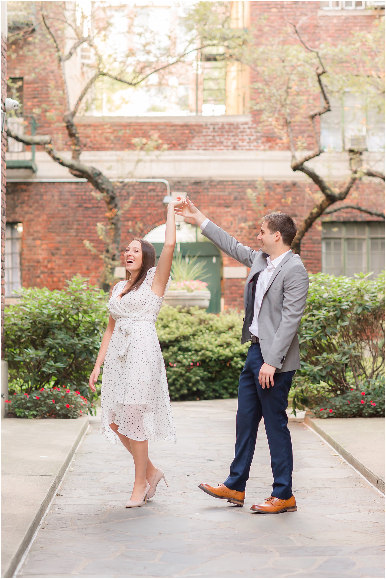 New York couple dances during engagement photos in Manhattan