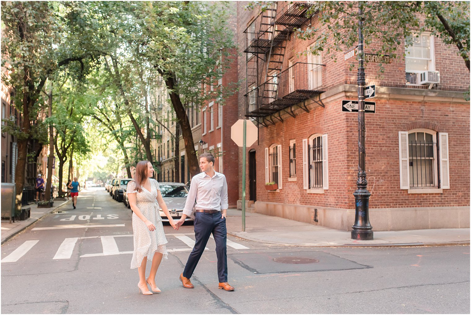 couple walks through Manhattan during engagement session