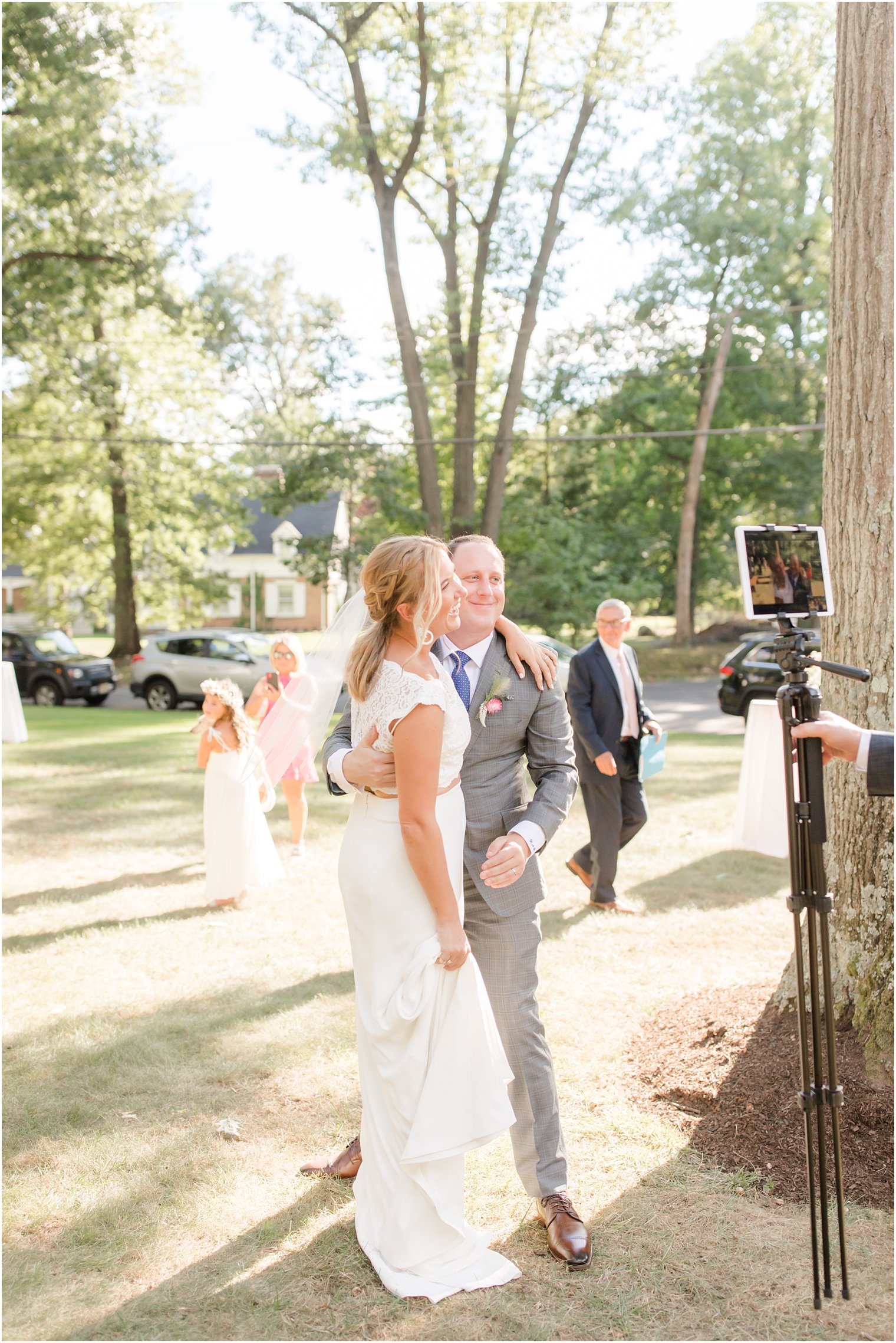 bride and groom talk to guests on video call