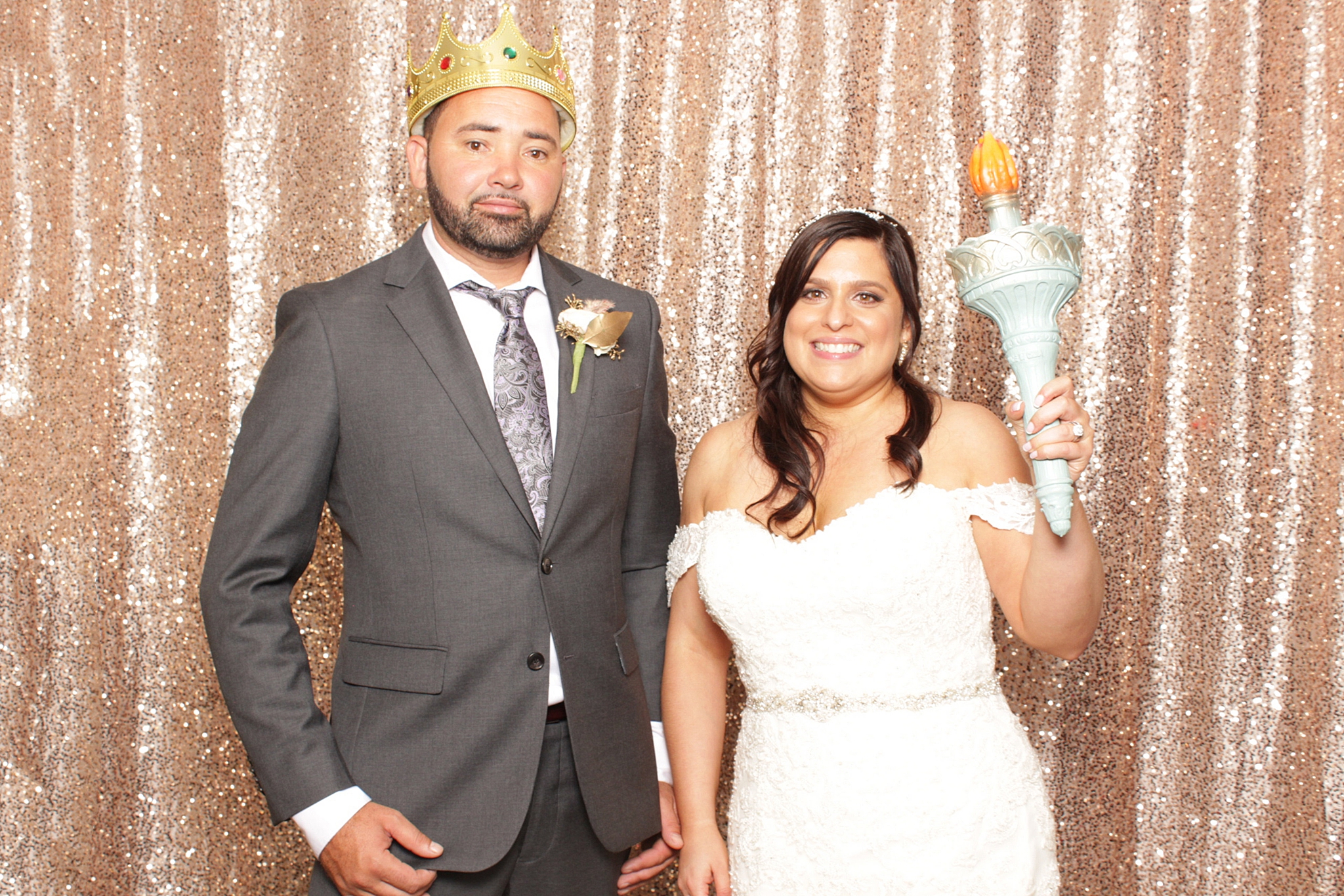bride and groom pose in photo booth