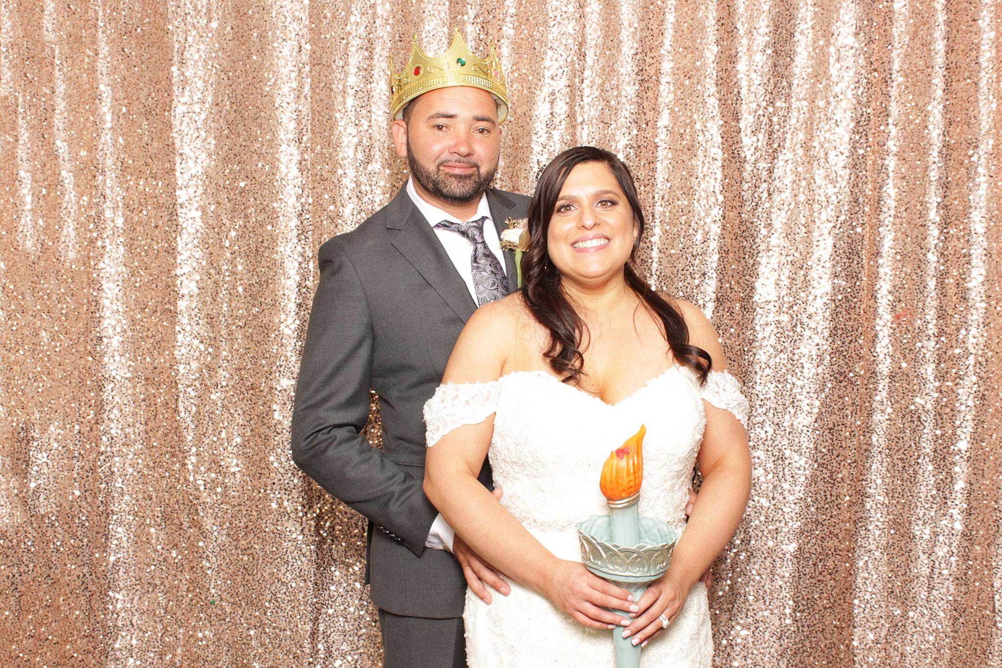 newlyweds pose in photo booth at Clarks Landing Yacht Club wedding