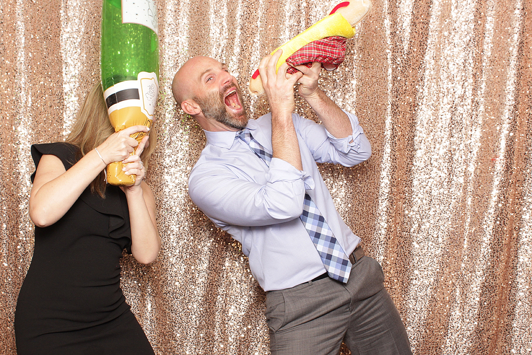 guests play with inflatable food in photo booth