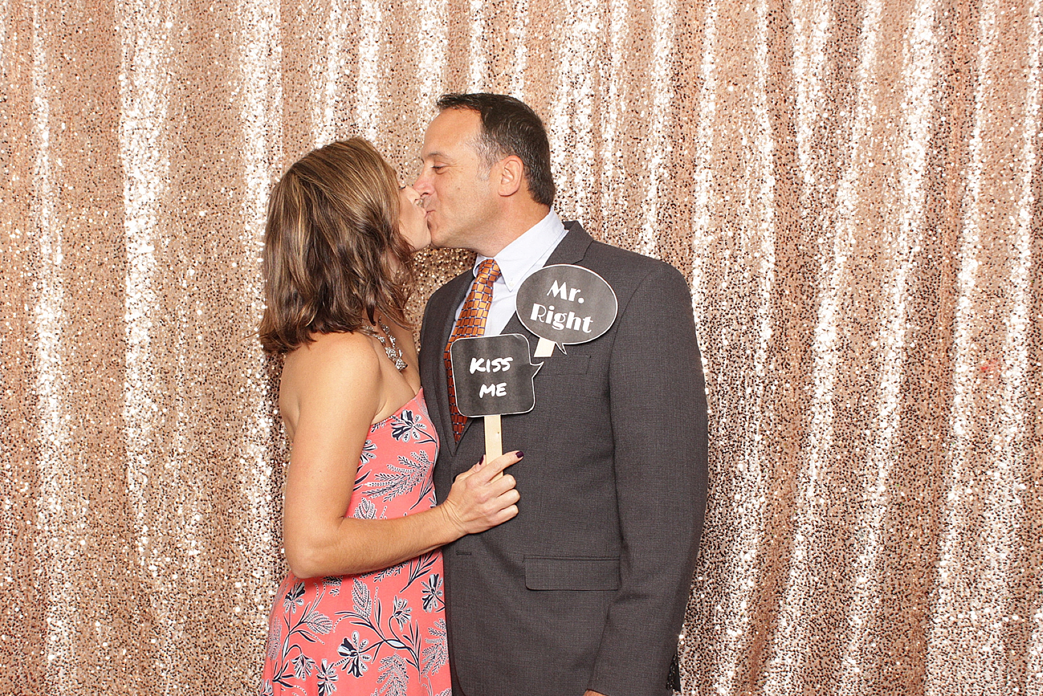 couple kisses in photo booth at Clarks Landing Yacht Club wedding reception