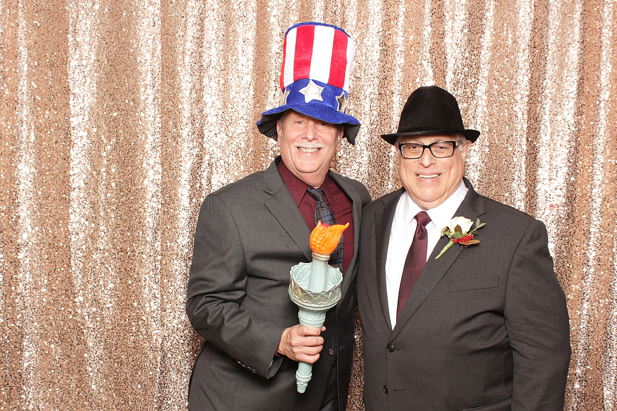 older gentlemen pose in photo booth