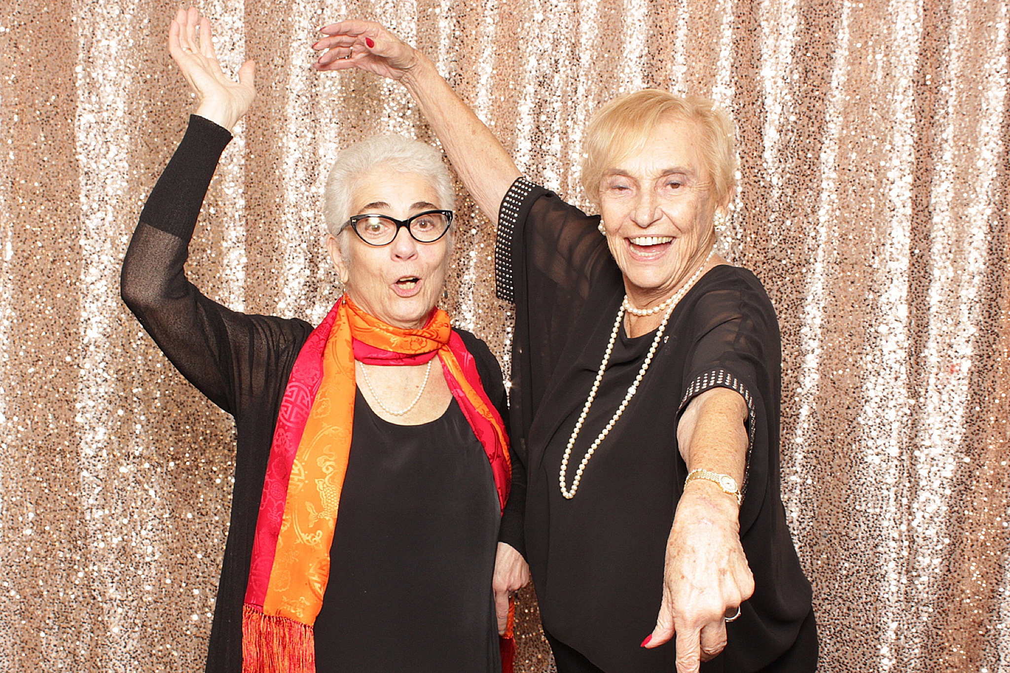 women dance during photo booth fun at Clarks Landing