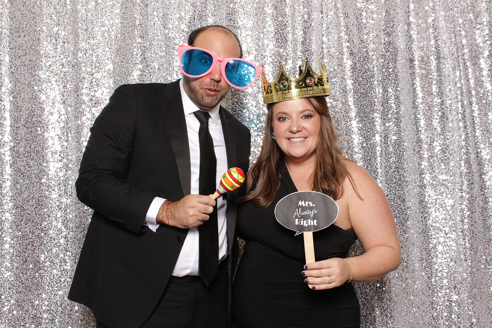 wedding guests pose with fun props during Park Chateau Estate Photo Booth