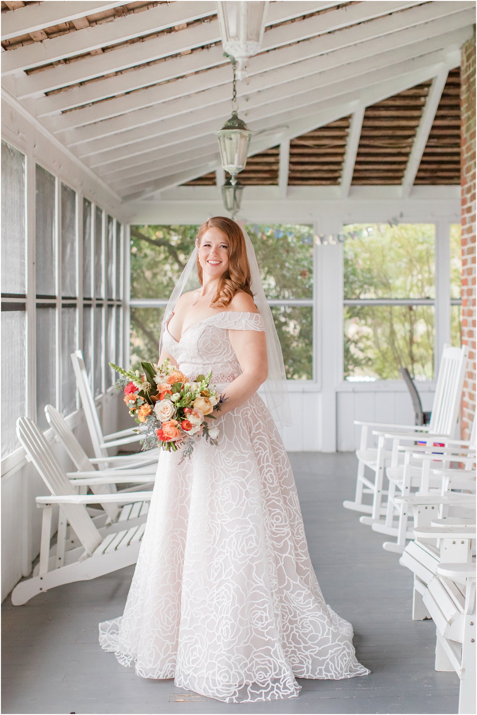 bride poses in wedding gown with rose overlay