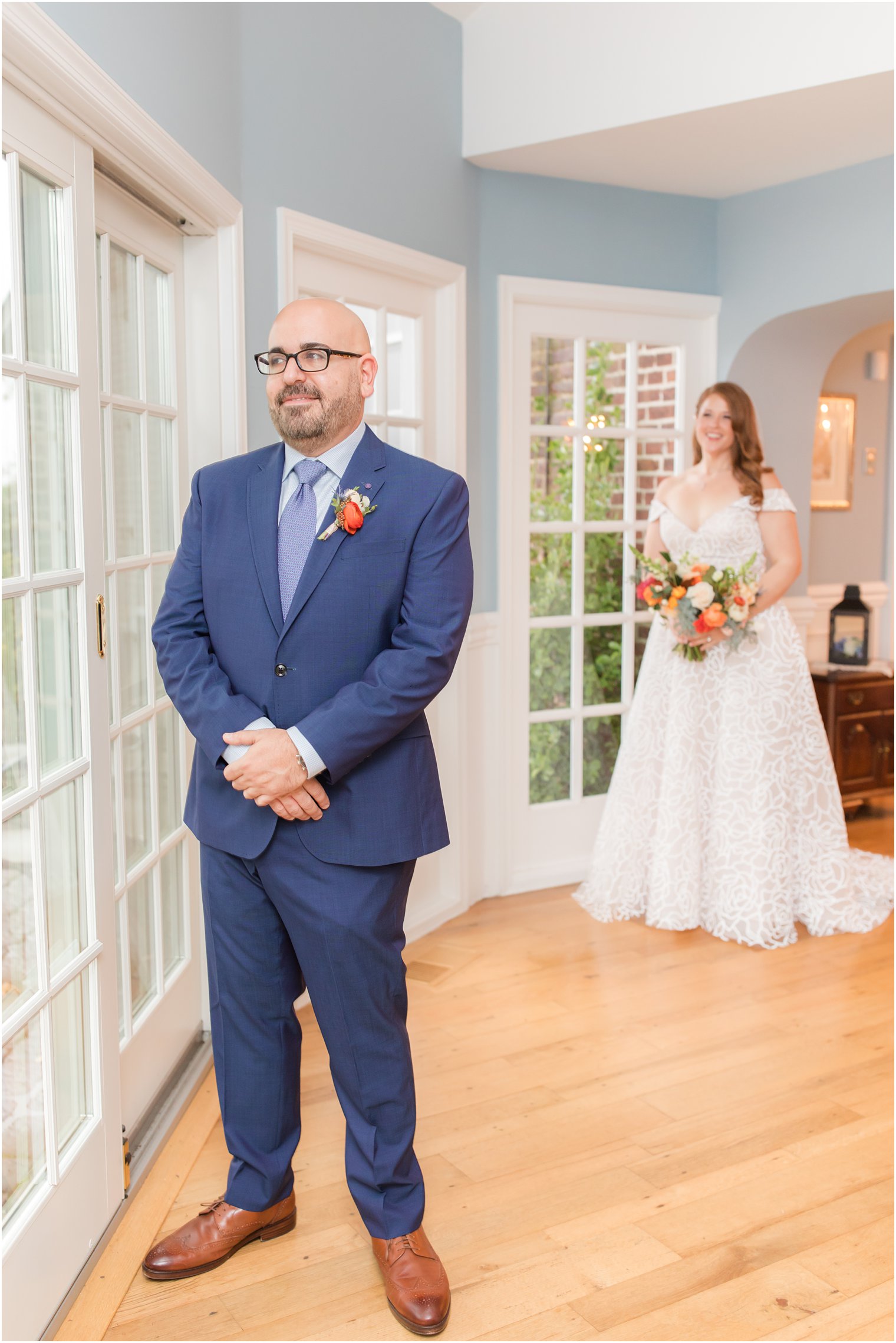 bride approaches groom before Eagle Manor Wedding for first look