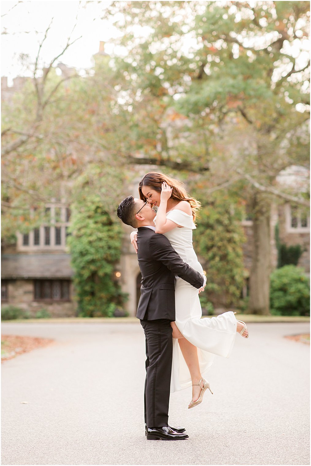 Groom lifting bride for engagement photos