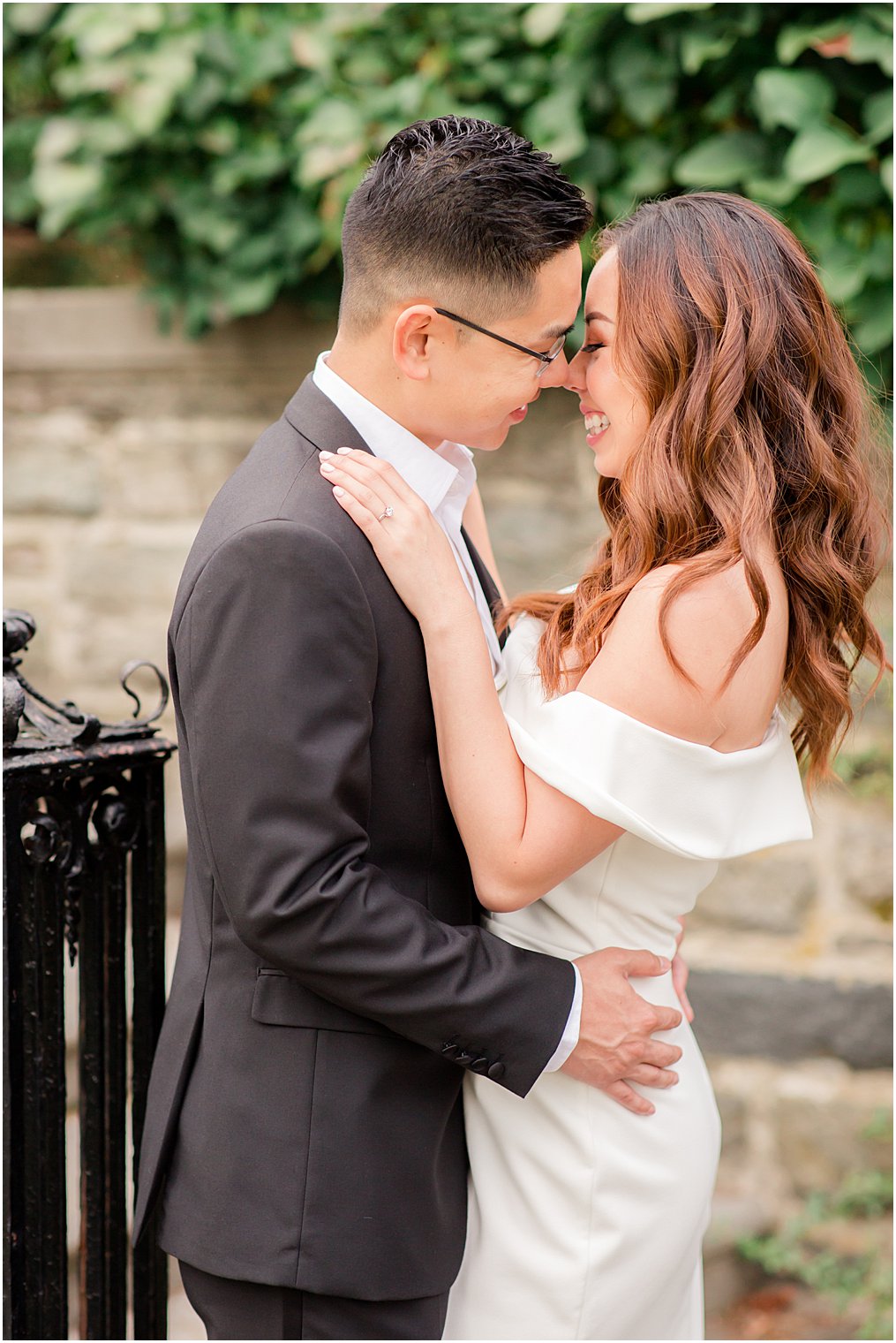 Bride and groom kissing during engagement photos