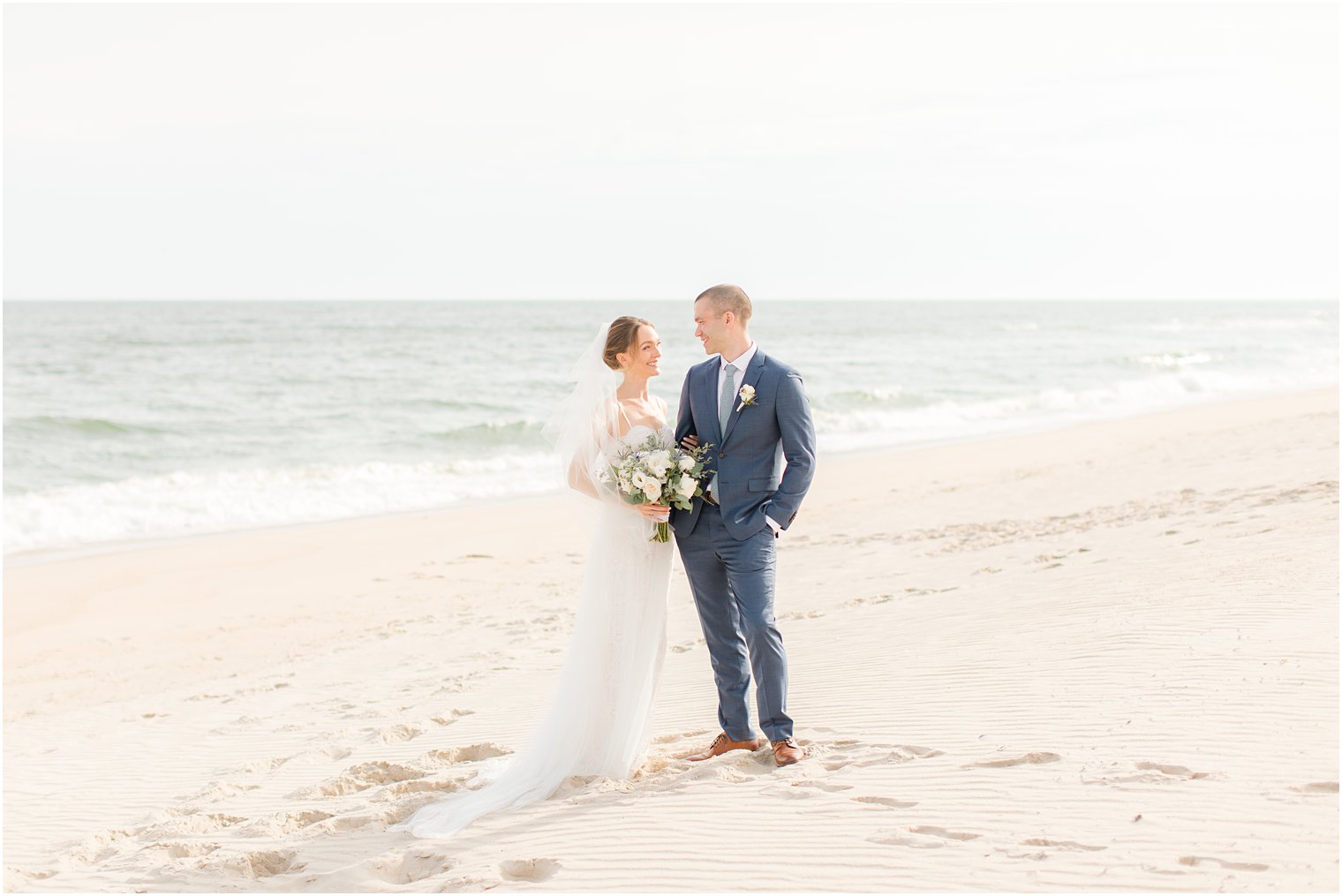 newlyweds pose on Long Beach Island