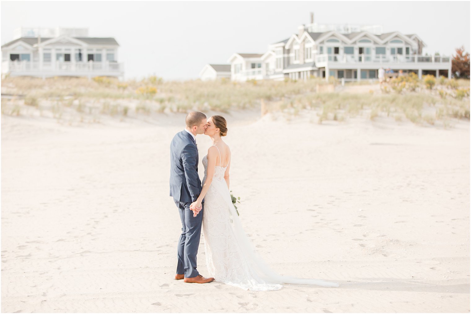 bride and groom kiss on Long Beach Island