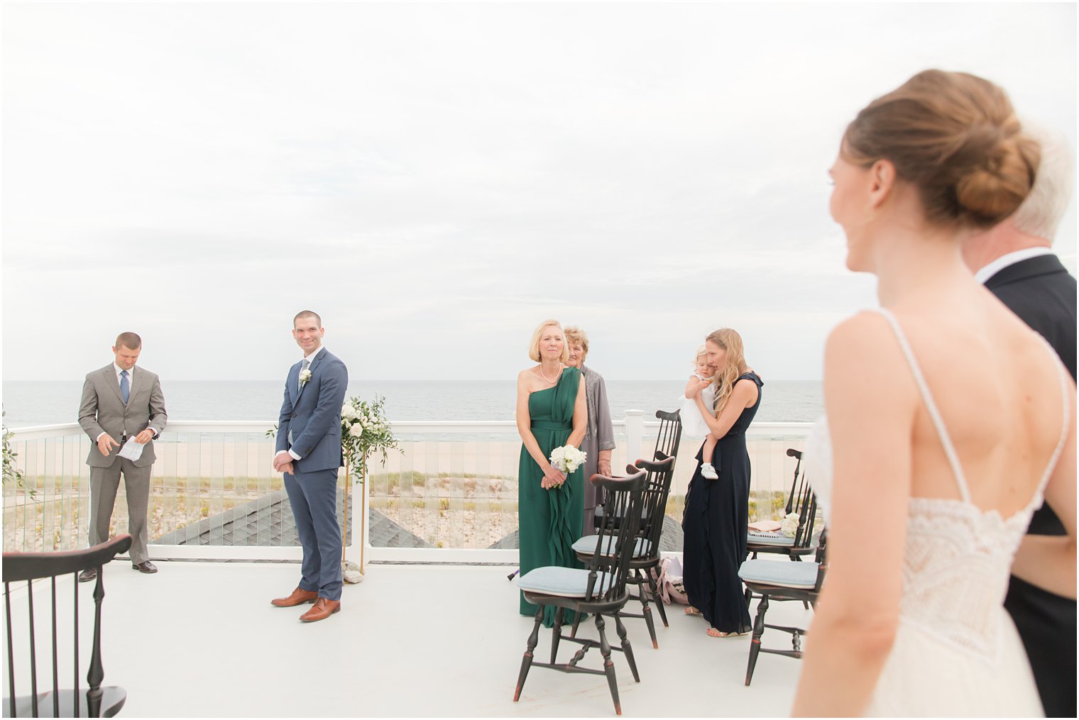 bride walks down aisle to meet groom