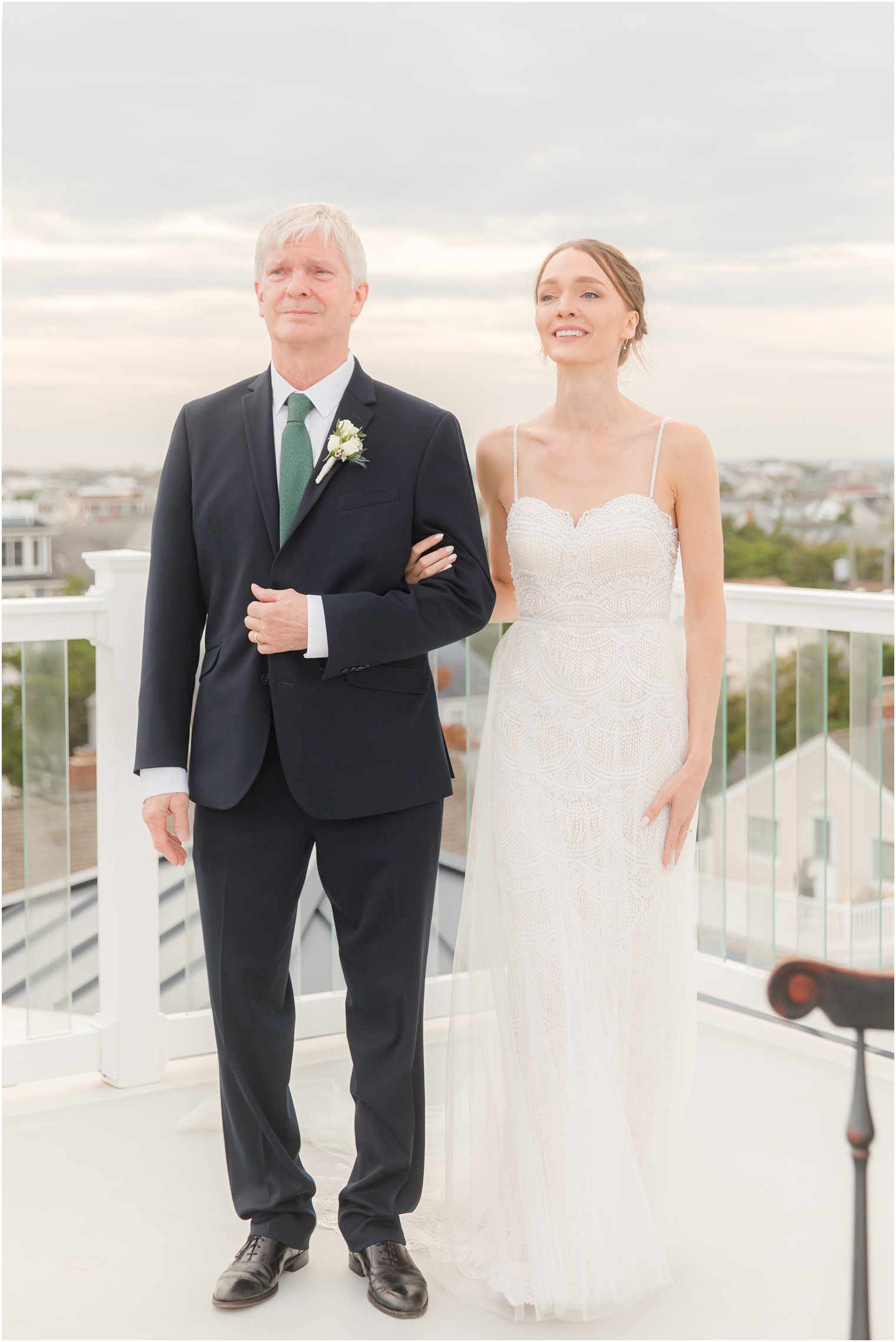 bride walks down aisle with dad during LBI wedding