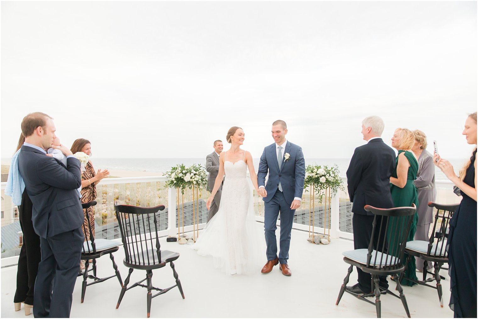 newlyweds walk up aisle after Long Beach Island wedding