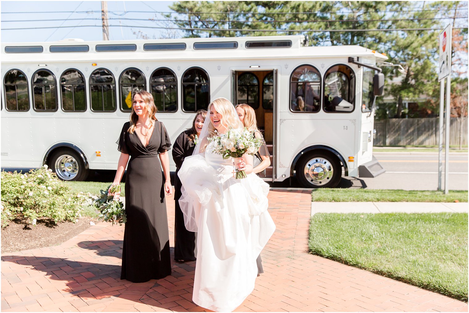 bride walks away from trolley with bridesmaids