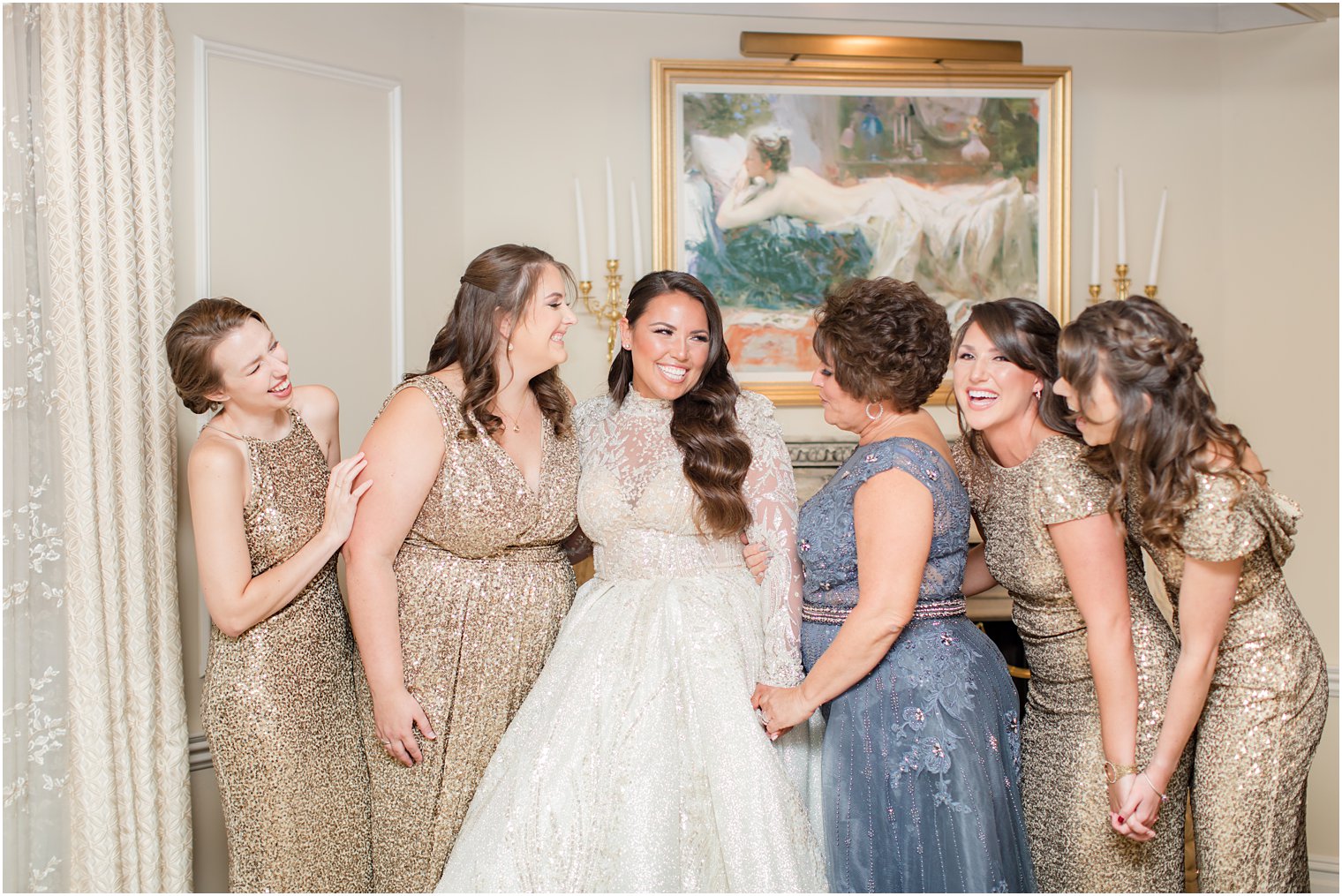 bride poses with bridesmaids and mom as maid of honor