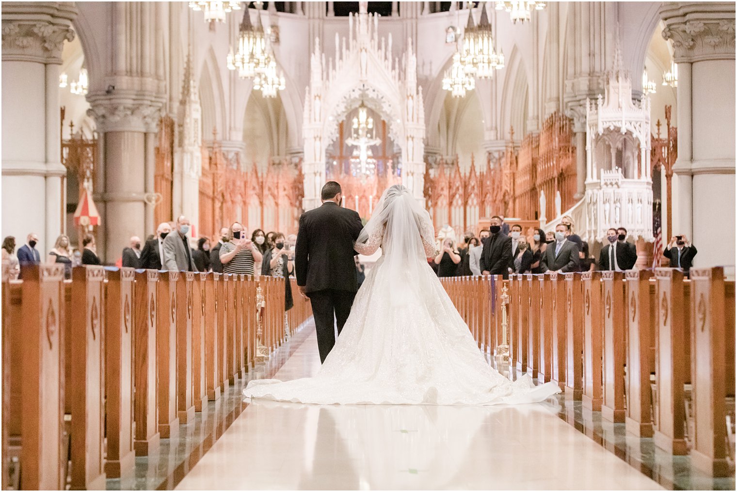bride walks down aisle at Cathedral Basilica of the Sacred Heart