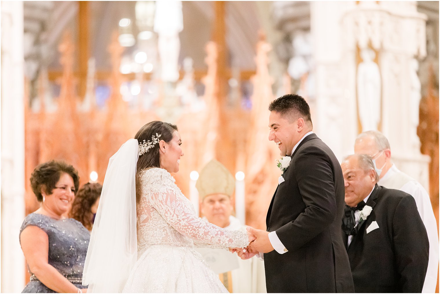 bride and groom laugh during traditional Catholic wedding at Cathedral Basilica of the Sacred Heart in Newark NJ