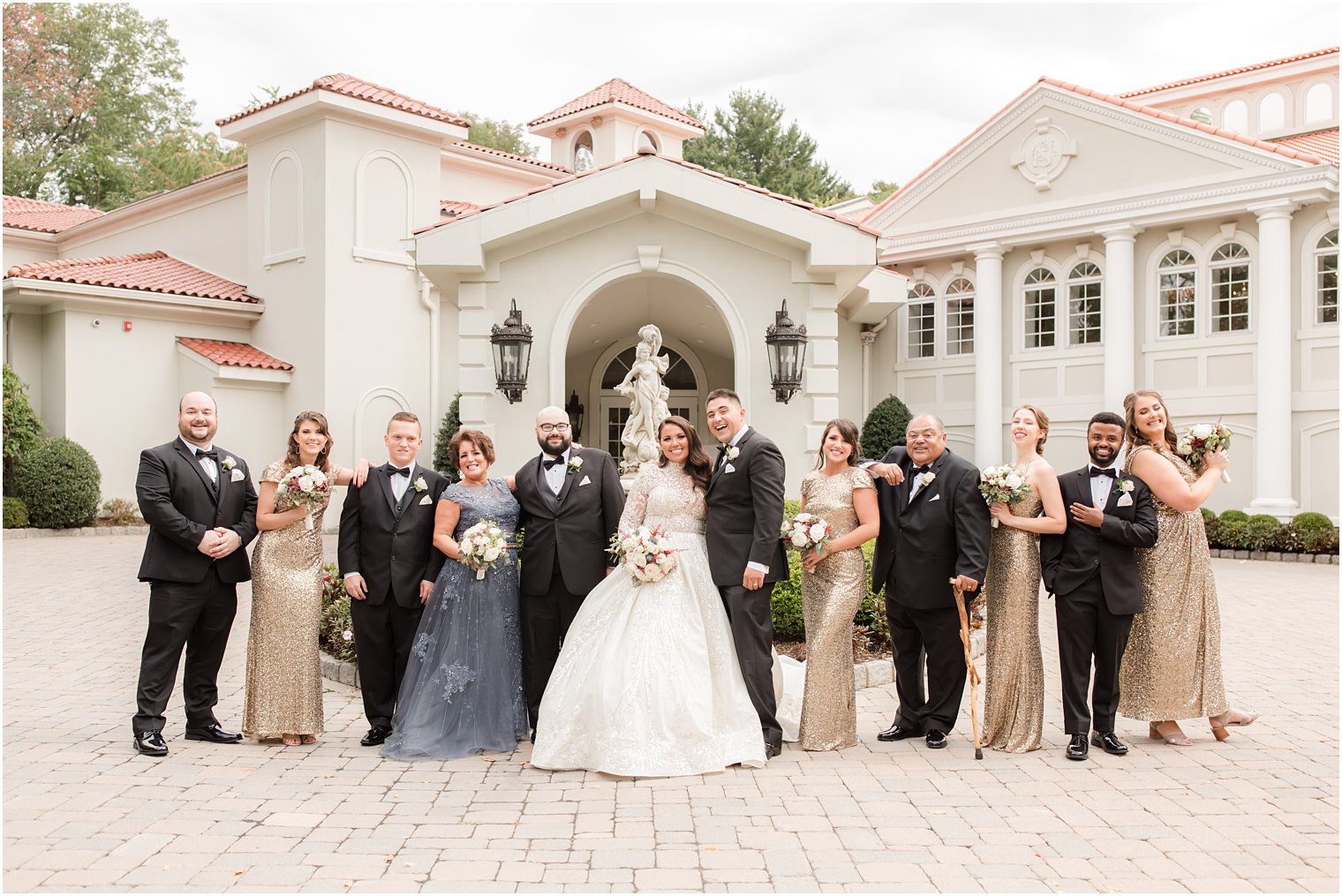 bride and groom pose with bridal party at Nanina's in the Park