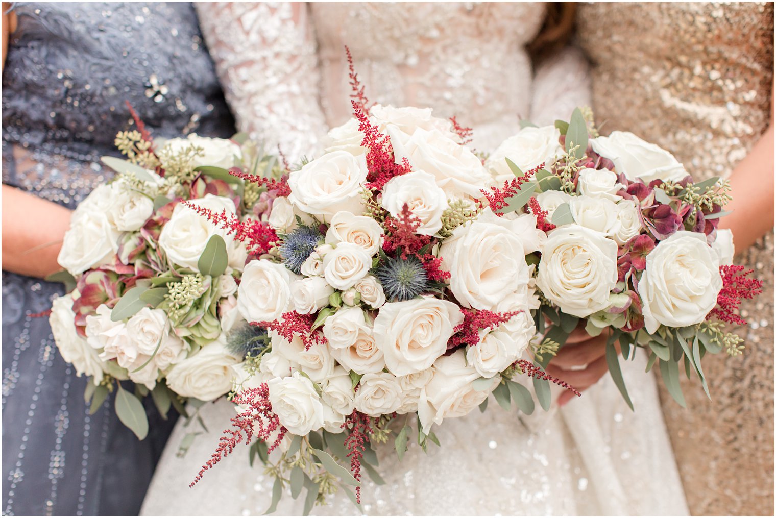 fall wedding bouquet with red ferns and ivory roses