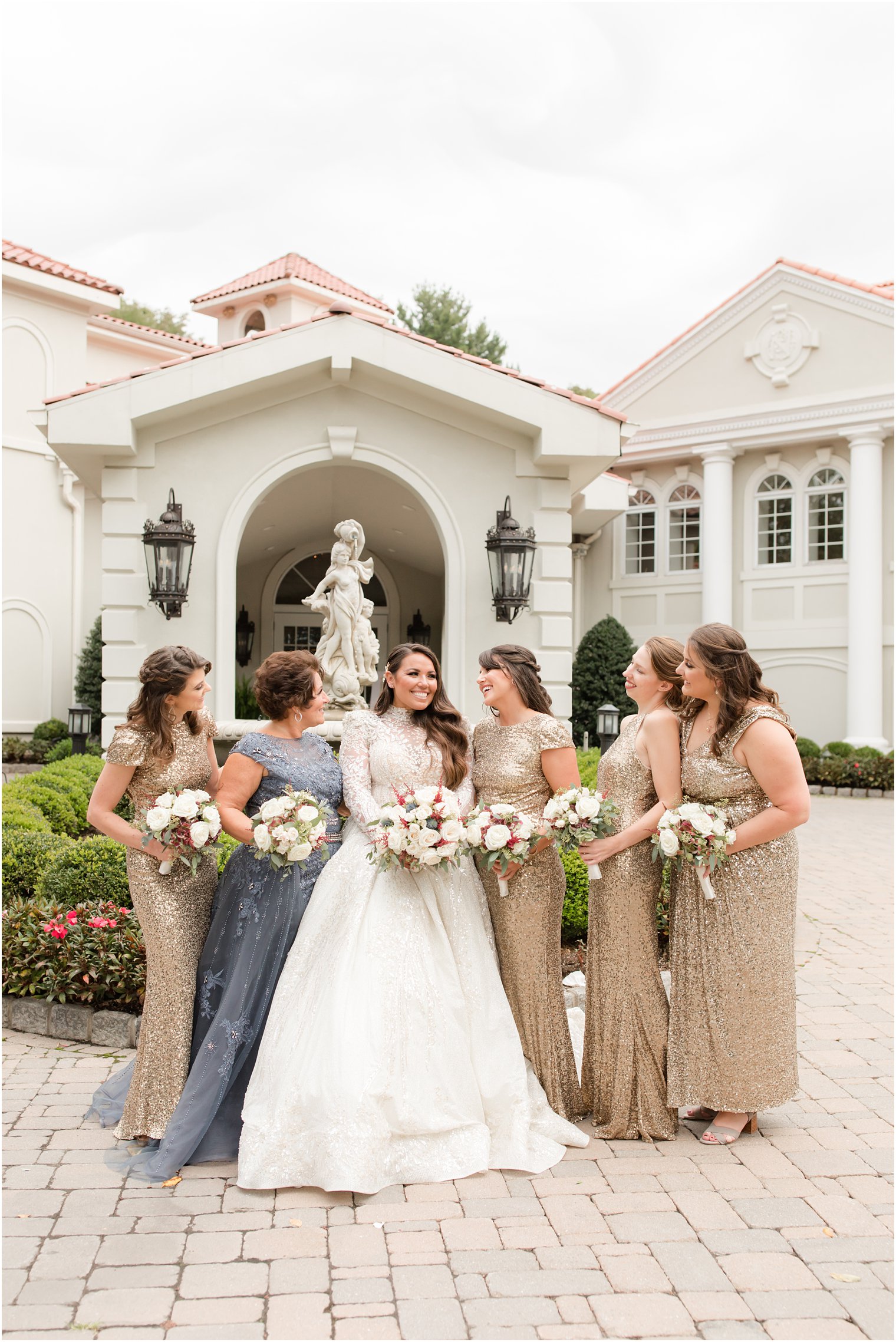 bridesmaids laugh with bride outside Nanina's in the Park